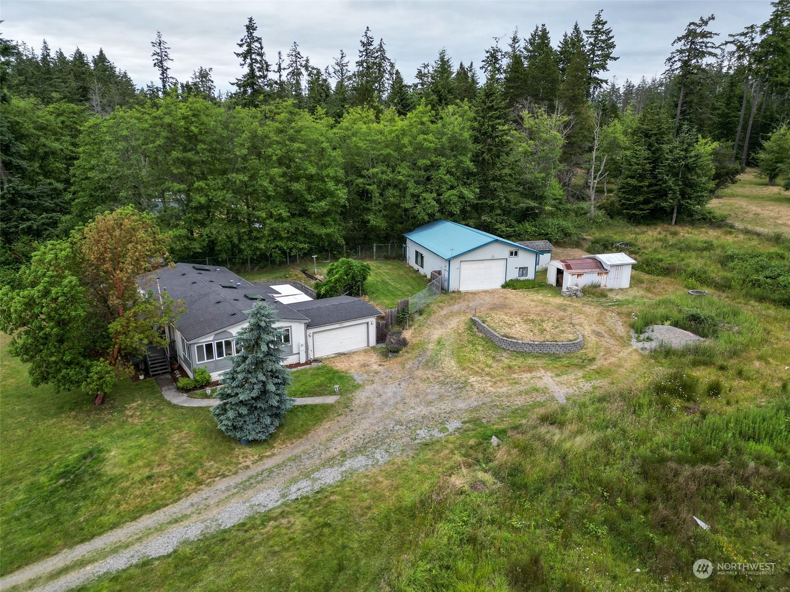3374 Best Road Oak Harbor, WA 98277 - Photo 5 of 39 an aerial view of a house with garden space and trees all around