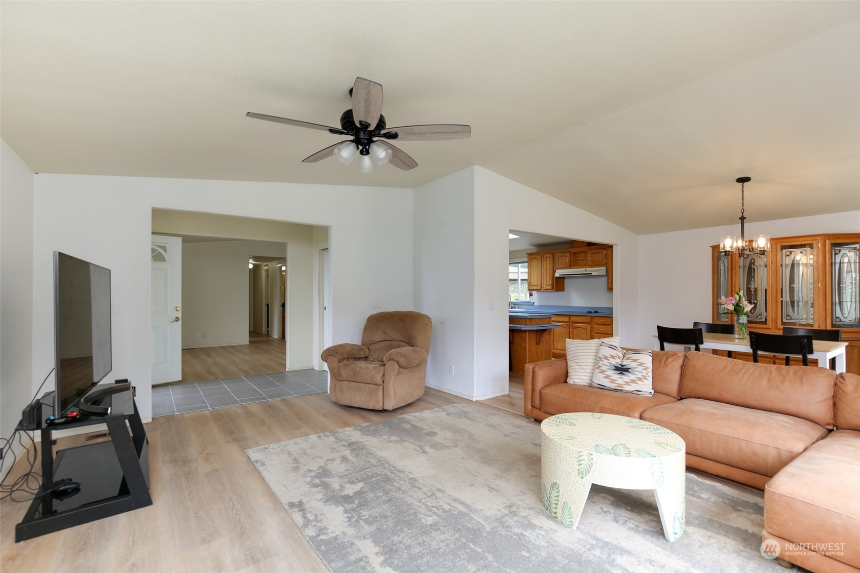 3374 Best Road Oak Harbor, WA 98277 - Photo 10 of 39 a living room with furniture a flat screen tv and a couch
