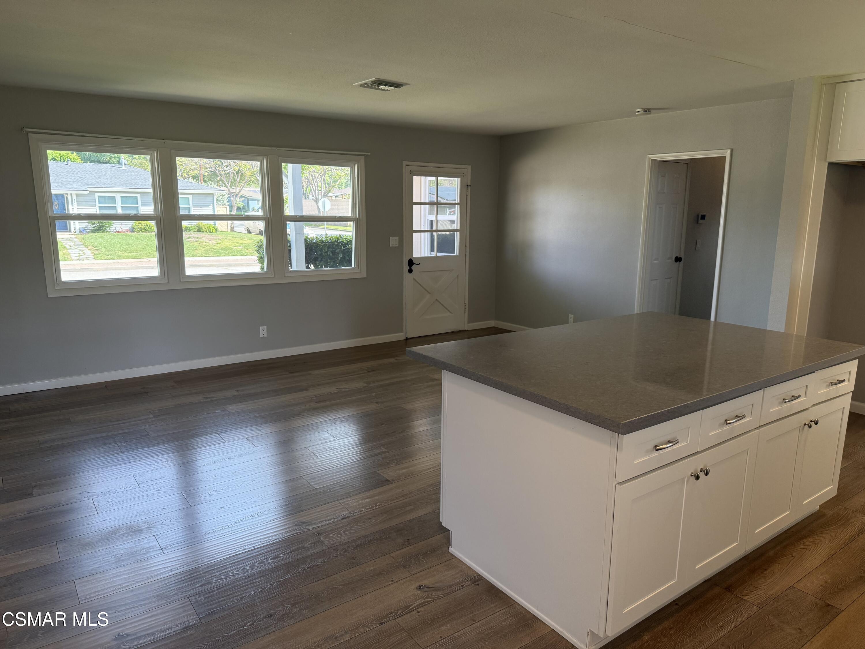 4090 Florence Street Simi Valley, CA 93063 - Photo 6 of 16 an empty room with wooden floor and windows