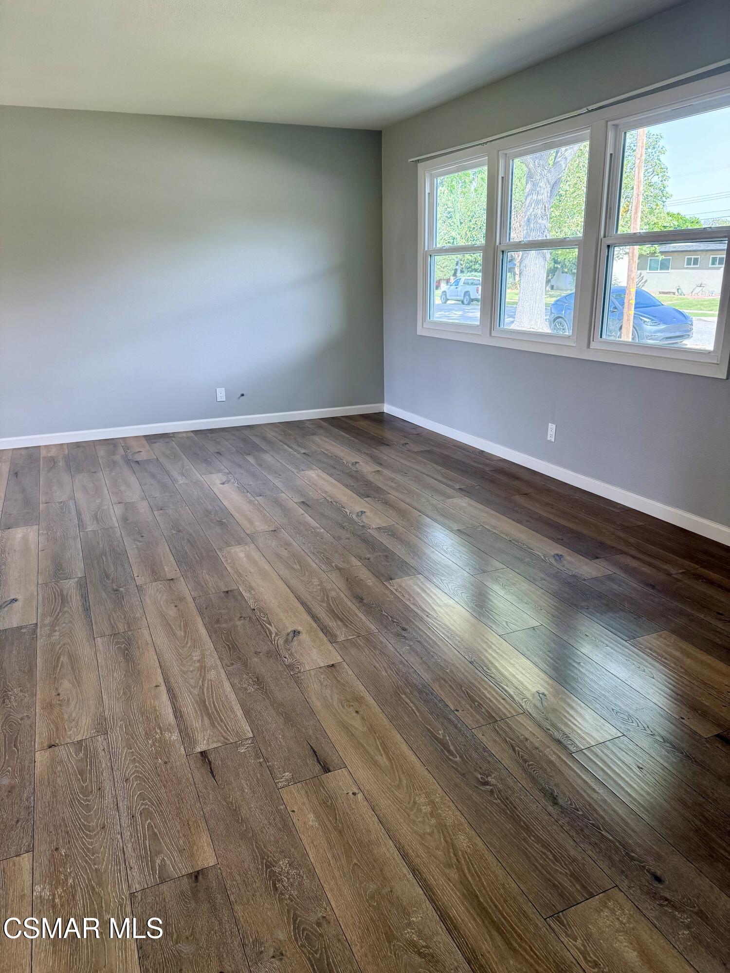 4090 Florence Street Simi Valley, CA 93063 - Photo 7 of 16 wooden floor in an empty room with a window