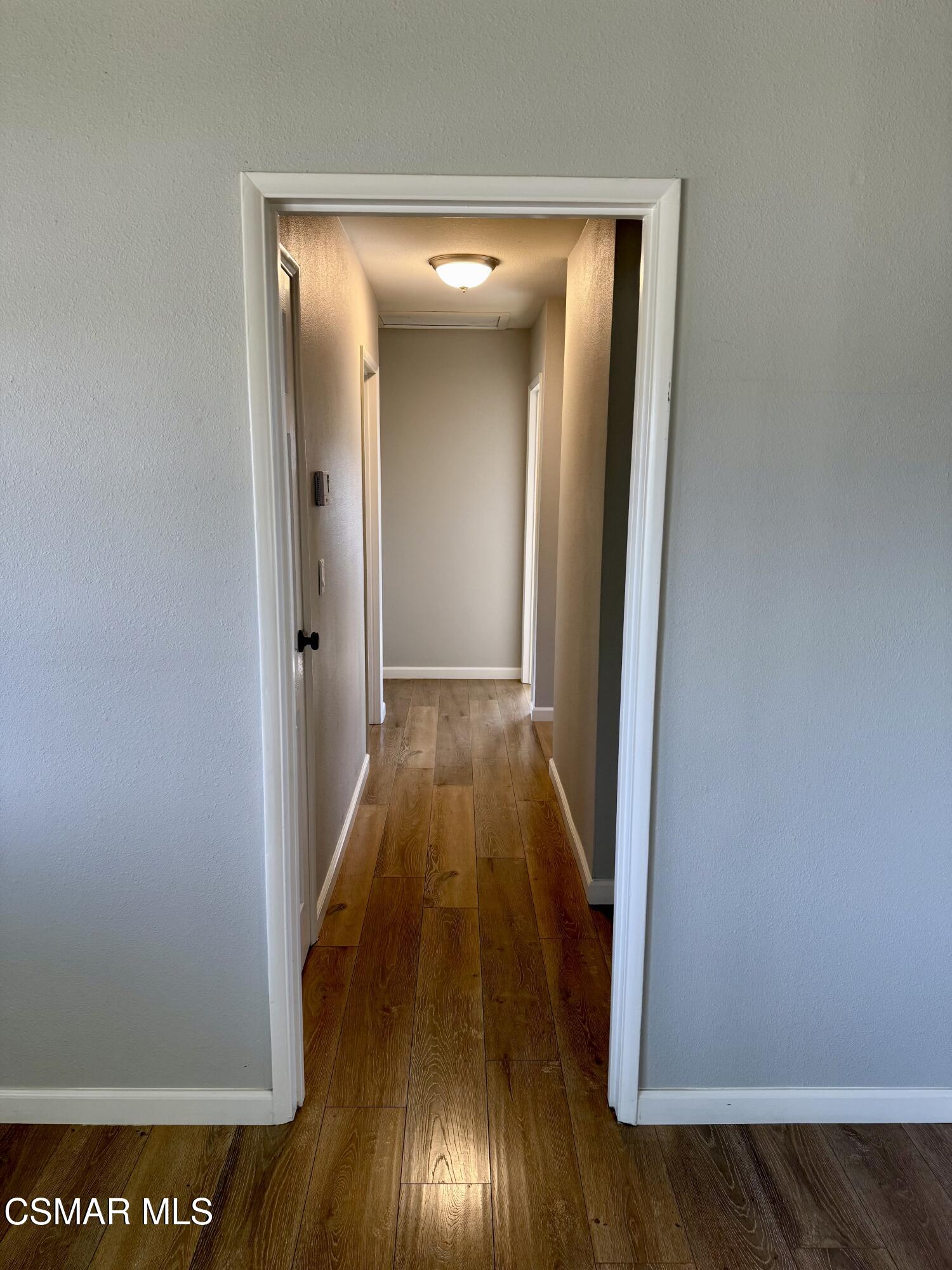4090 Florence Street Simi Valley, CA 93063 - Photo 8 of 16 a view of a hallway with wooden floor