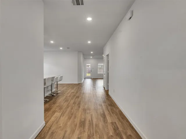 a view of gallery with wooden floor