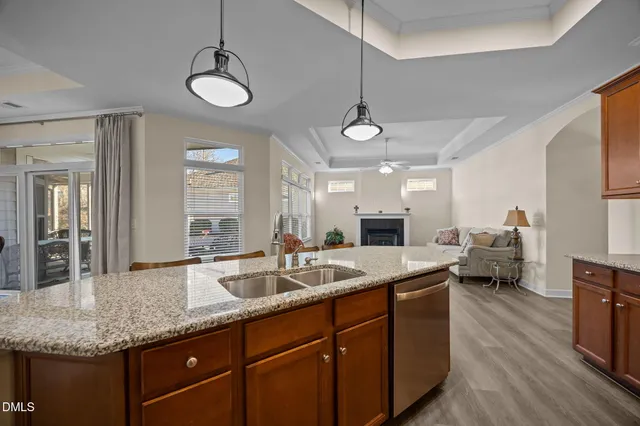 a kitchen with sink stove and refrigerator