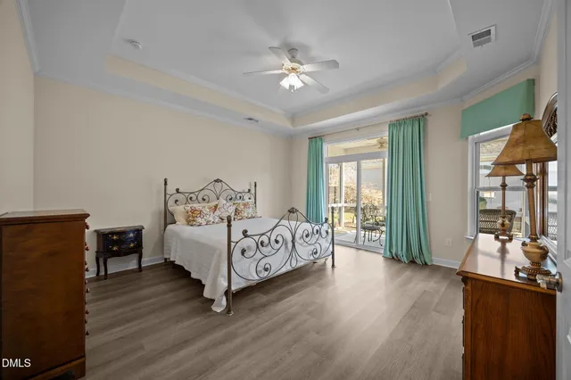 a bed room with a bed and a chandelier