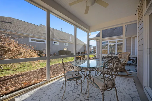 a view of a porch with furniture and front door
