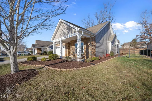 a view of a house with backyard and porch