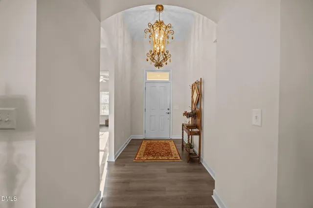 a view of an entryway with wooden floor
