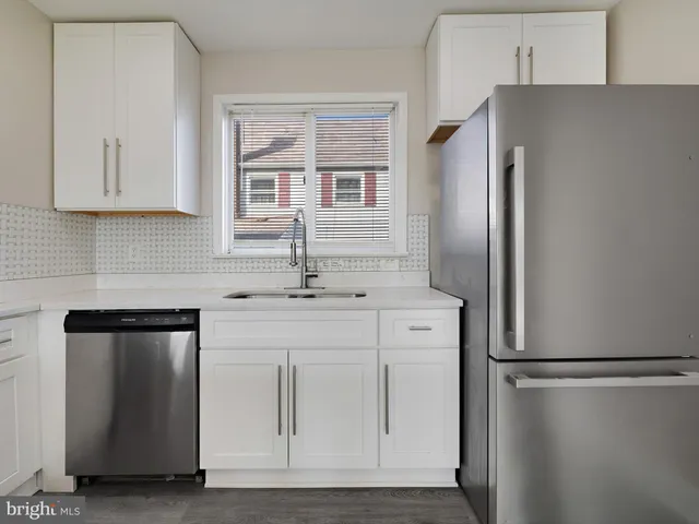 a kitchen with a refrigerator stove and microwave