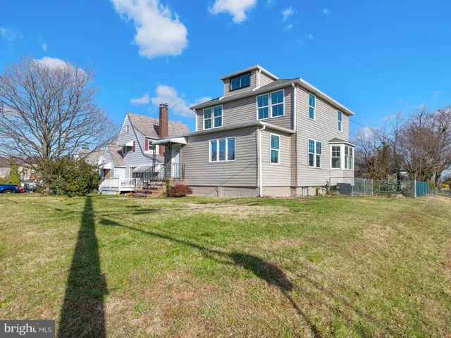 a front view of house with yard and seating area
