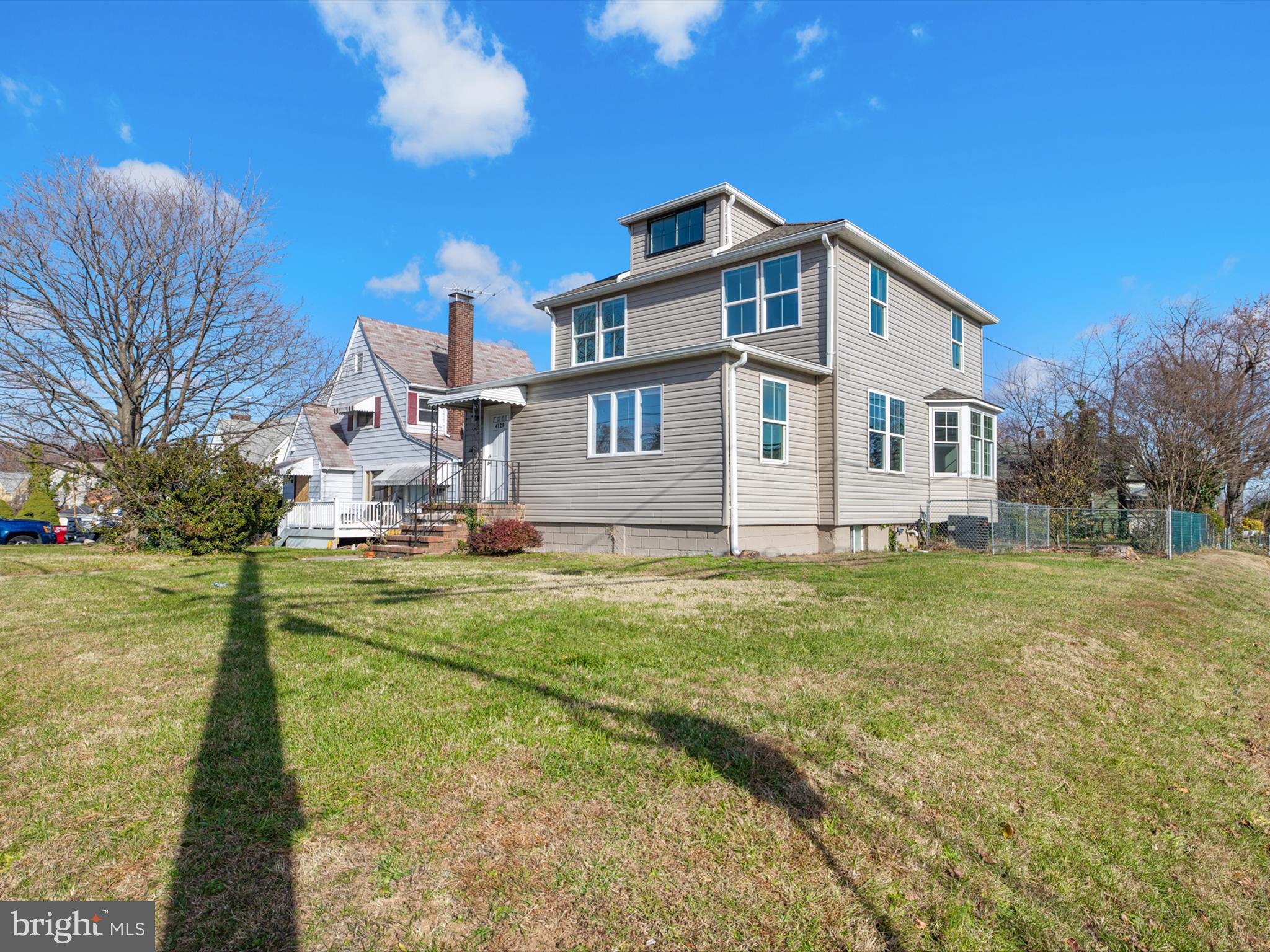 4129 5th Street Baltimore, MD 21225 - Photo 2 of 52 a front view of house with yard and seating area