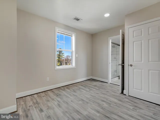 a bathroom with a toilet a sink and shower