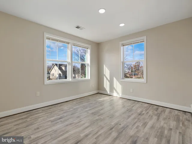 a view of an empty room with stairs