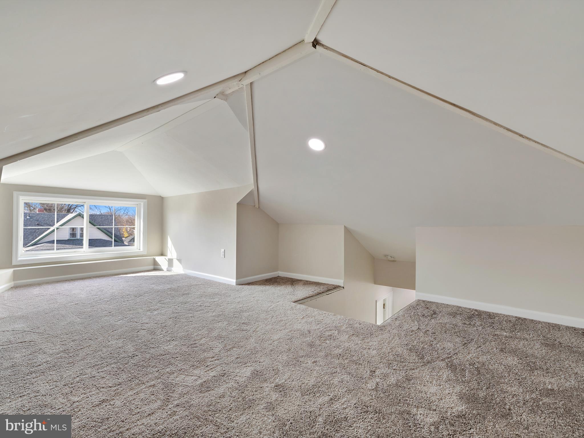 4129 5th Street Baltimore, MD 21225 - Photo 36 of 52 an empty room with a ceiling fan and window