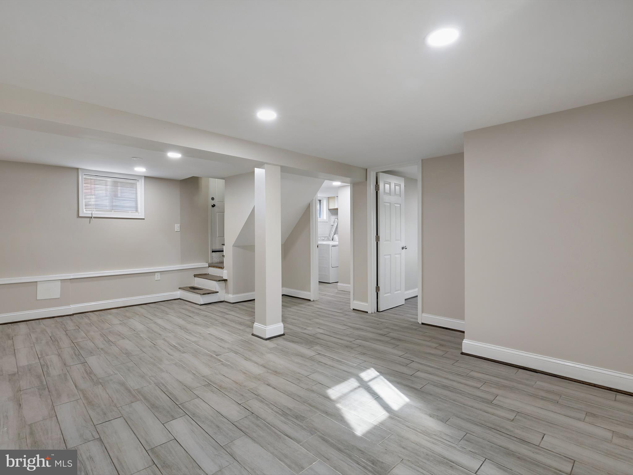 4129 5th Street Baltimore, MD 21225 - Photo 38 of 52 a view of an empty room with wooden floor