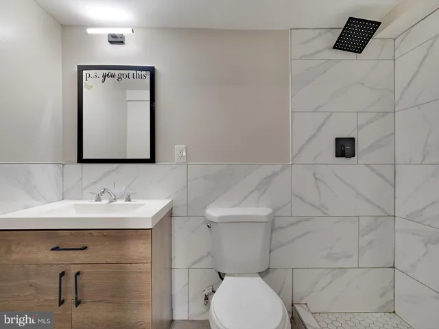 a view of a balcony with wooden fence