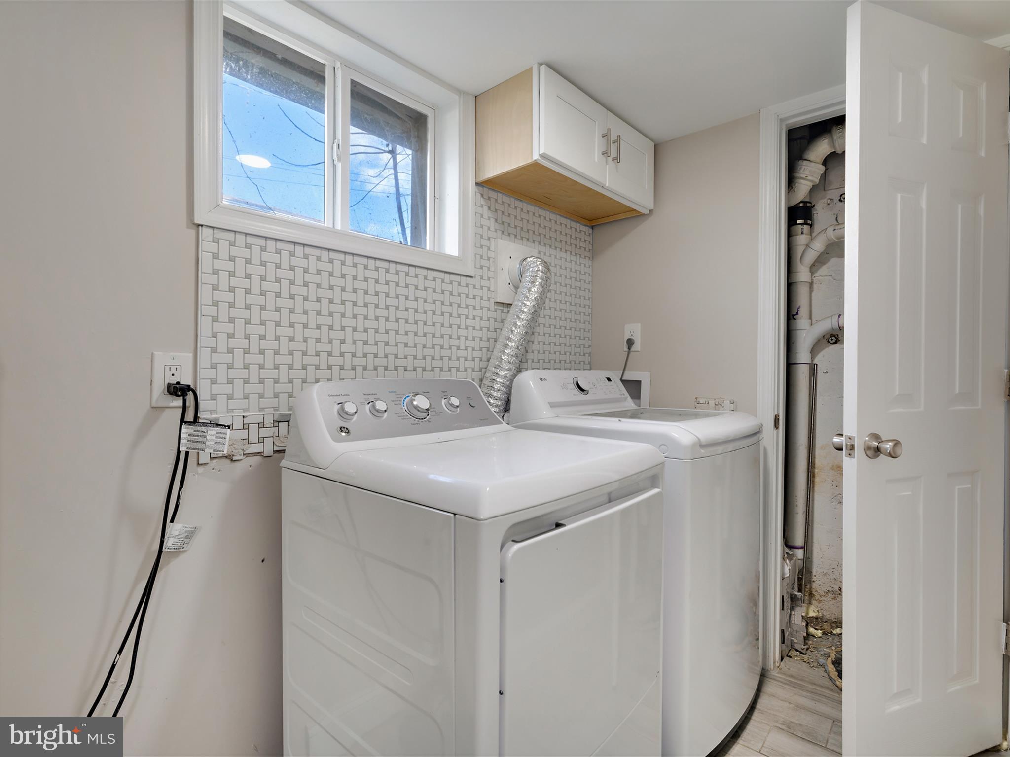 4129 5th Street Baltimore, MD 21225 - Photo 42 of 52 a utility room with dryer and washer