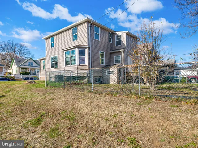 a picture of a bench in front of a wall