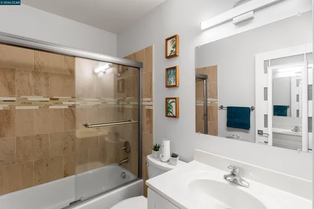 a bathroom with a bathtub and a sink