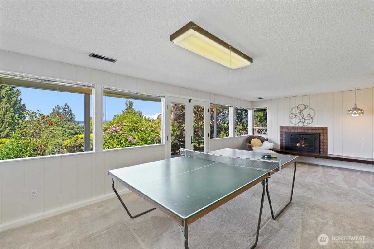 2606 49th Place Southwest Everett, WA 98203 - Photo 23 of 37 a dining room with furniture and a floor to ceiling window