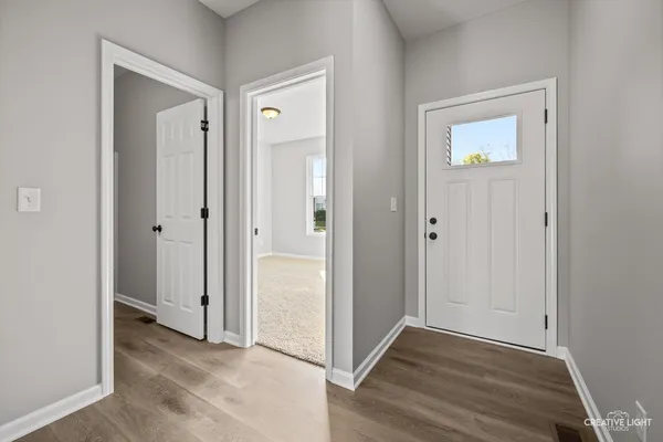 an empty room and wooden door