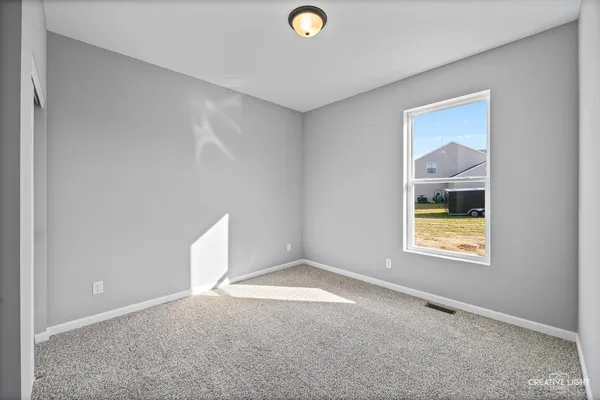 a view of an empty room and window