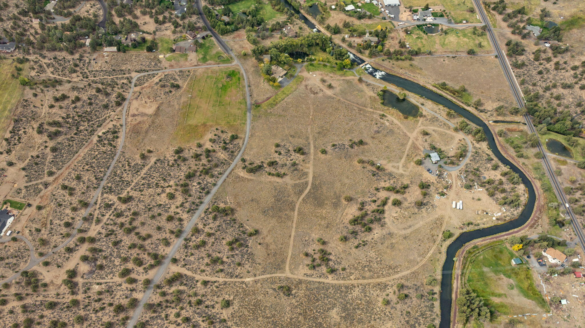 21925 Bear Creek Road Bend, OR 97702 - Photo 7 of 104 Full arial photo of 38 acres with canal, ponds and two entrances. UGB nearby and development potential