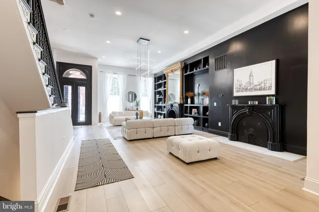 a large kitchen with stainless steel appliances lots of counter space and wooden floor