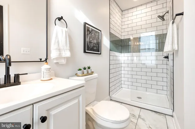 a view of a balcony with wooden floor and fence