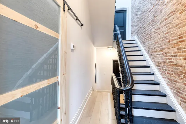 a bedroom with a large bed and a flat screen tv