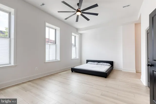 a bathroom with a sink a mirror and shower