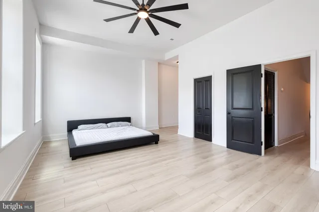a bathroom with double vanity sinks and a mirror