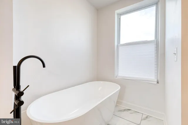 a view of backyard with a outdoor space