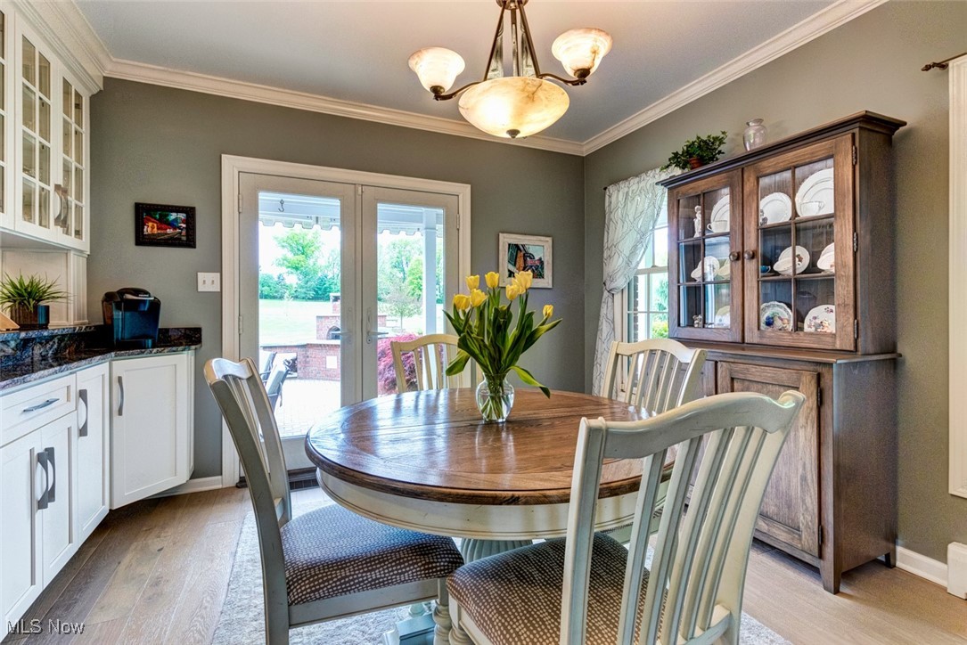 10850 Prouty Road Painesville, OH 44077 - Photo 19 of 50 Sunny breakfast area with a door to back patio