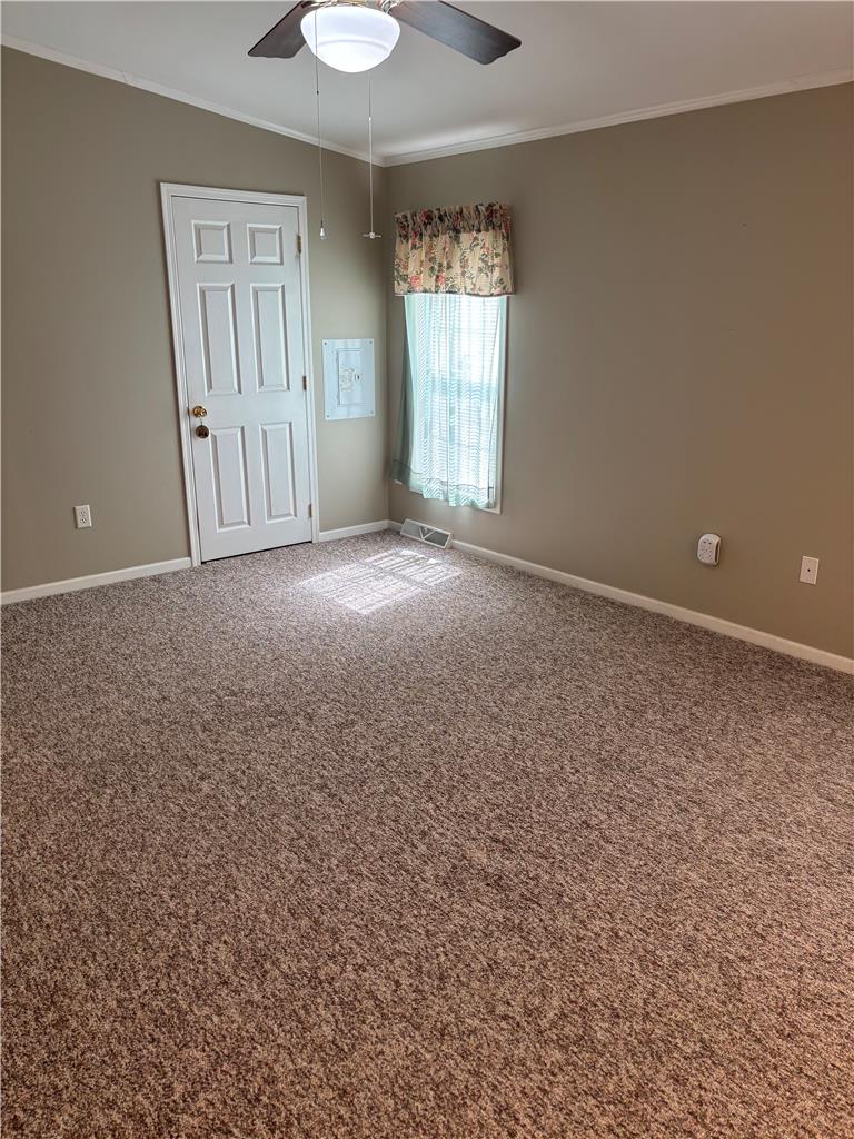 11 Abbey Road Easton, PA 18040 - Photo 16 of 24 Soft carpeting pairs with neutral walls and classic crown molding in this versatile room.