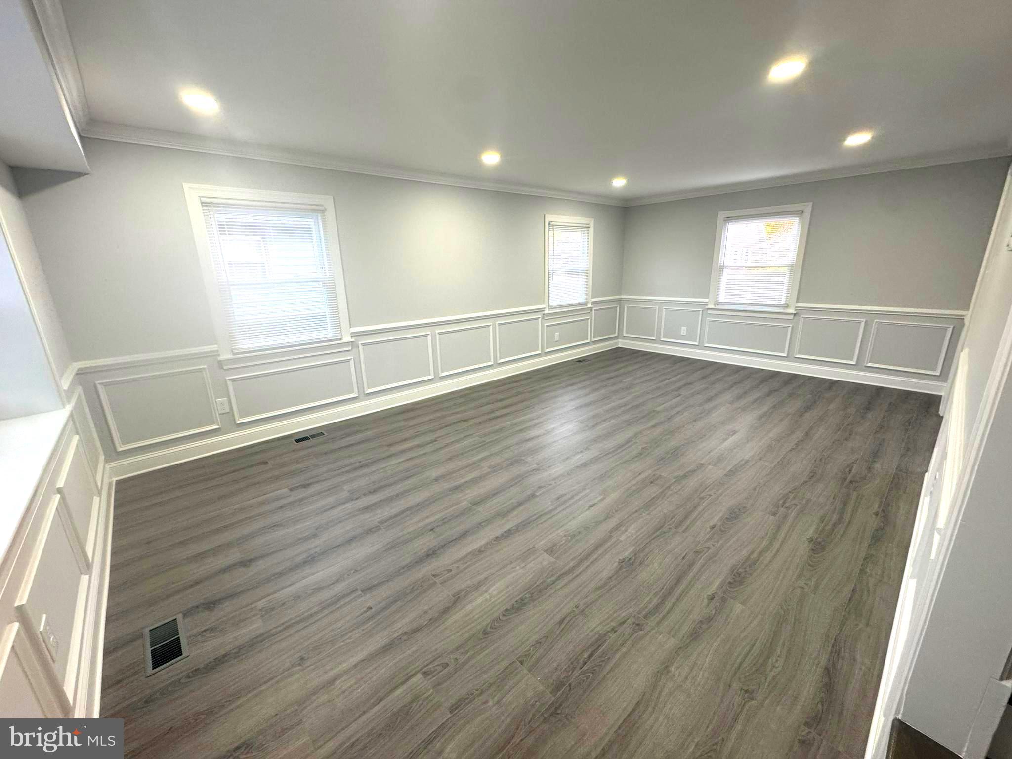 18 Grayson Circle Willingboro, NJ 08046 - Photo 15 of 57 an empty room with wooden floor and windows