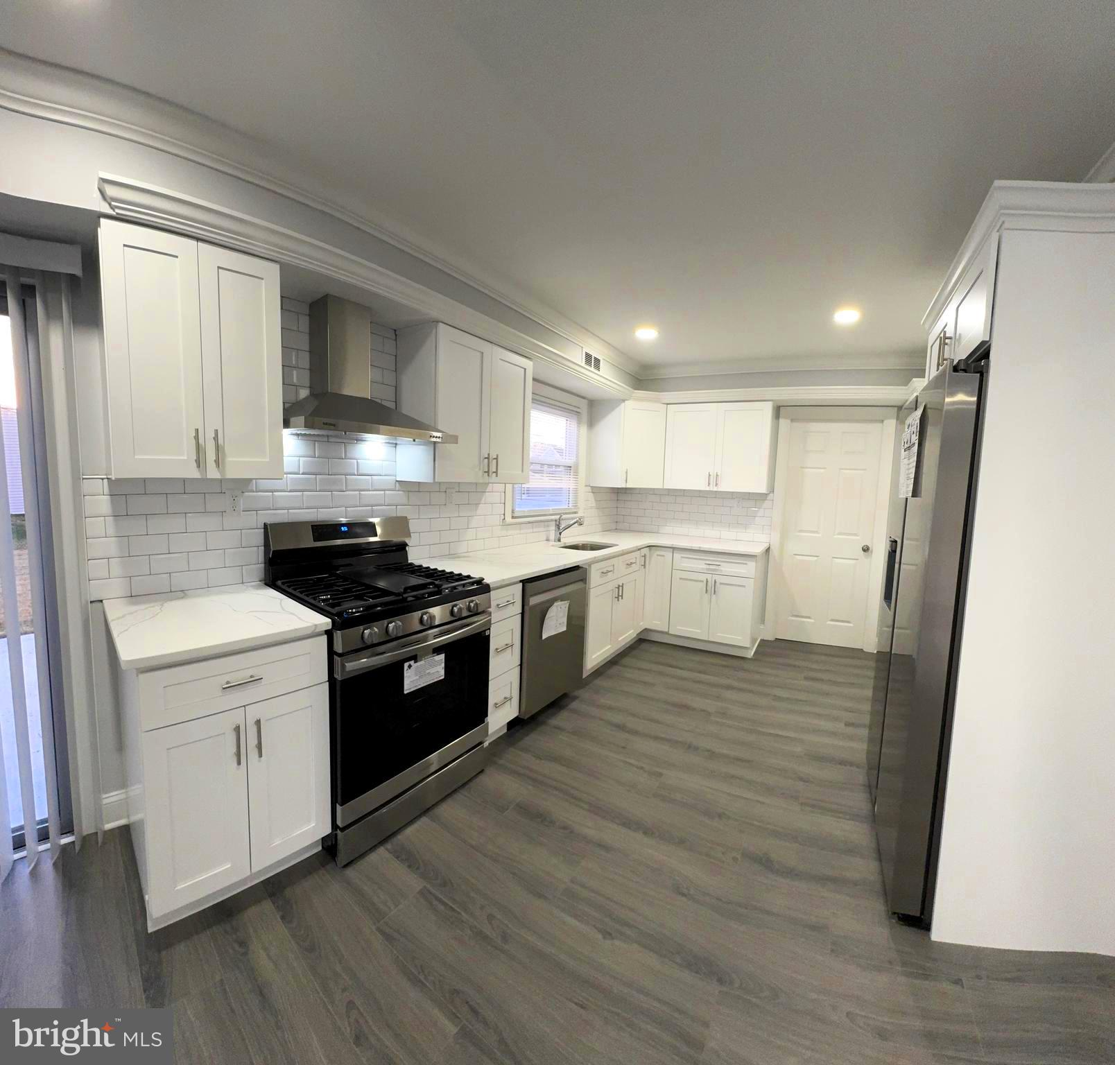 18 Grayson Circle Willingboro, NJ 08046 - Photo 24 of 57 a kitchen with a stove top oven sink and cabinets