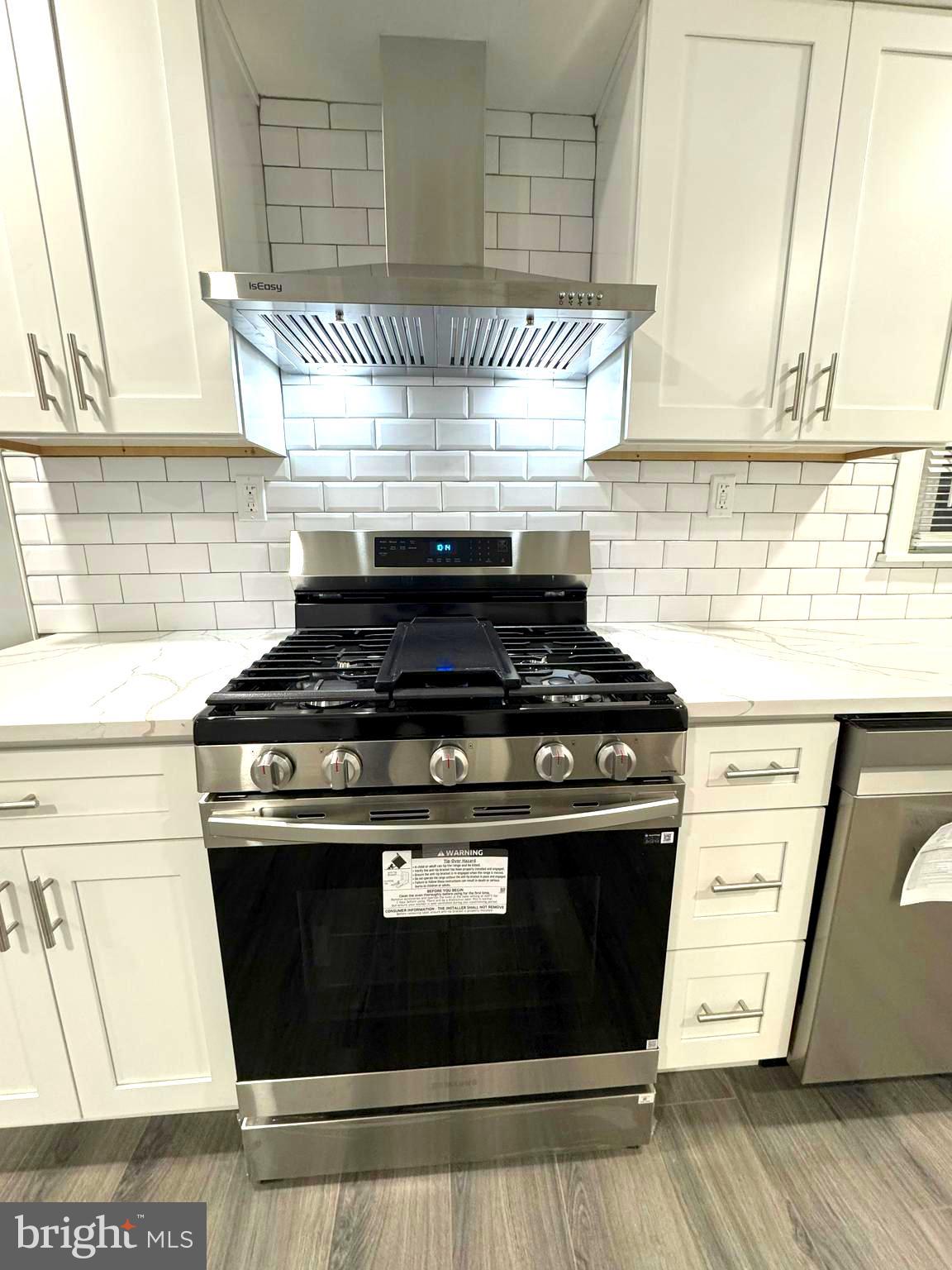 18 Grayson Circle Willingboro, NJ 08046 - Photo 29 of 57 a stove top oven sitting inside of a kitchen