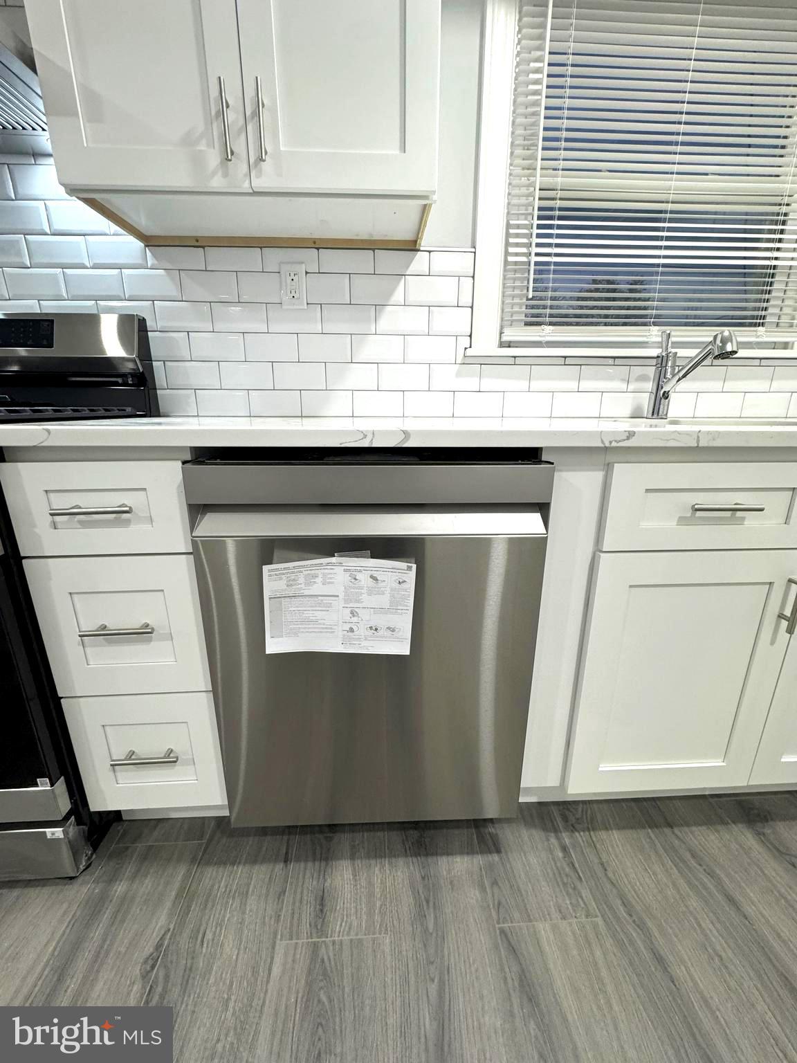 18 Grayson Circle Willingboro, NJ 08046 - Photo 30 of 57 a kitchen with granite countertop a stove and a sink