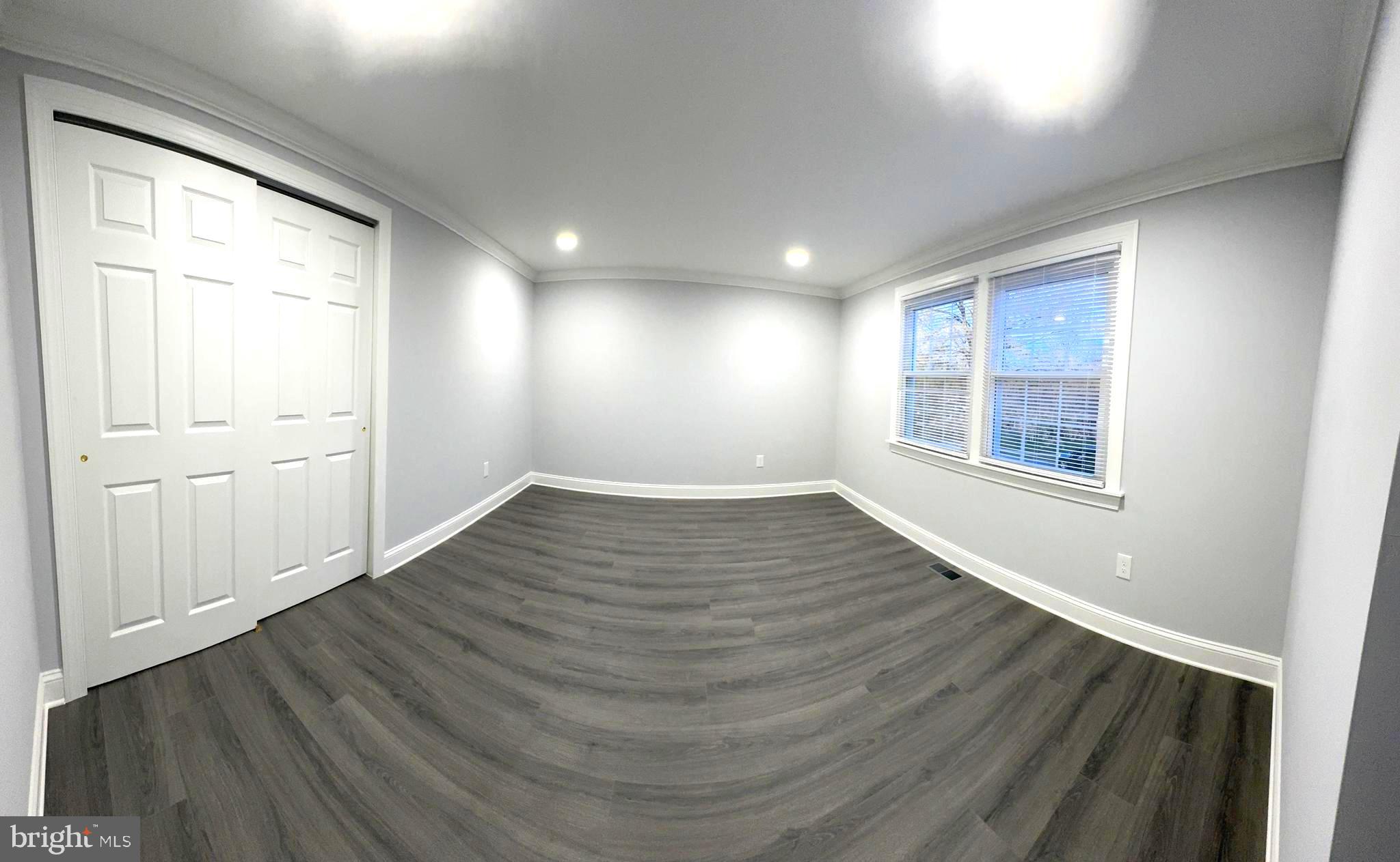 18 Grayson Circle Willingboro, NJ 08046 - Photo 38 of 57 an empty room with wooden floor and windows
