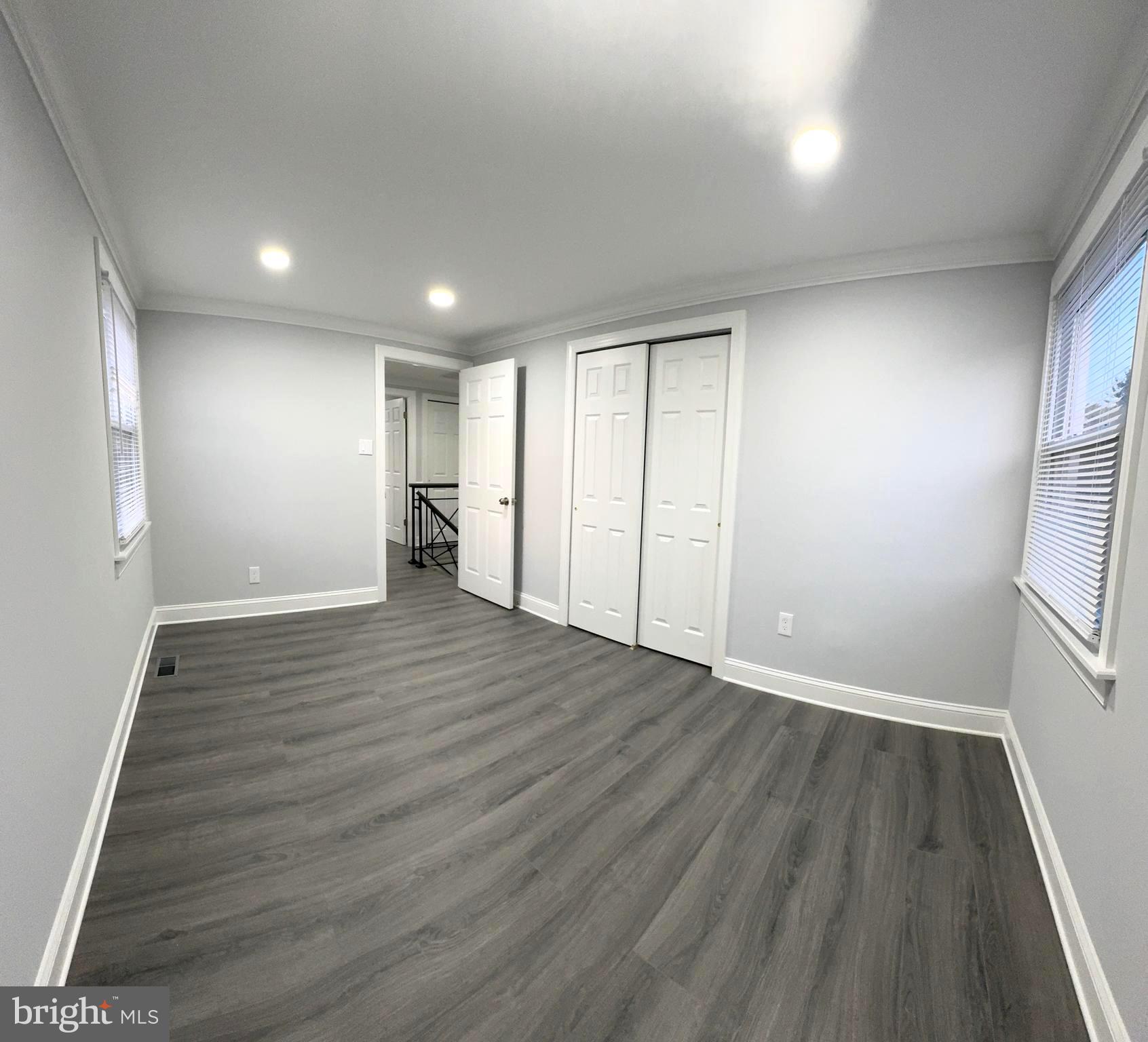 18 Grayson Circle Willingboro, NJ 08046 - Photo 39 of 57 an empty room with wooden floor and windows