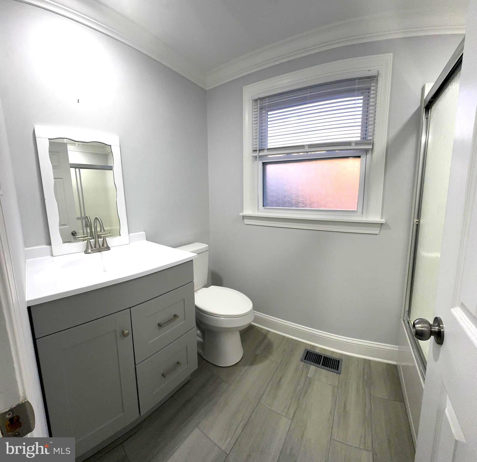 18 Grayson Circle Willingboro, NJ 08046 - Photo 45 of 57 a bathroom with a toilet sink and mirror