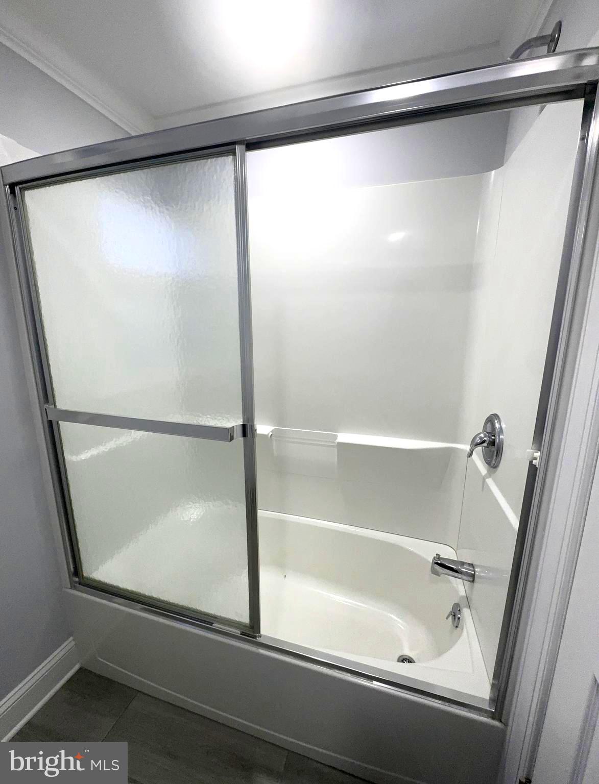 18 Grayson Circle Willingboro, NJ 08046 - Photo 46 of 57 a bathroom with a glass shower door