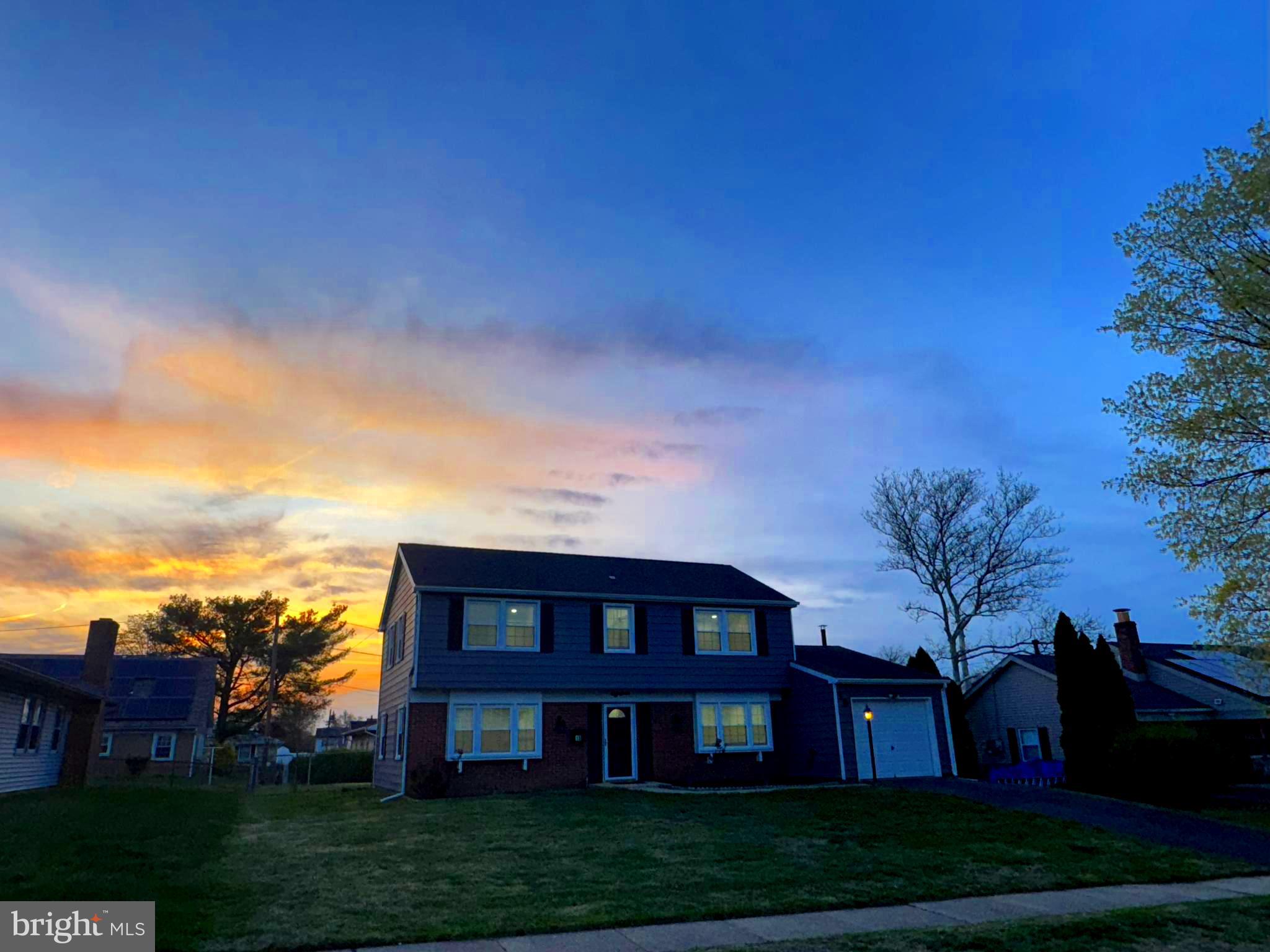 18 Grayson Circle Willingboro, NJ 08046 - Photo 48 of 57 a view of a big yard in front of a brick house with a large tree