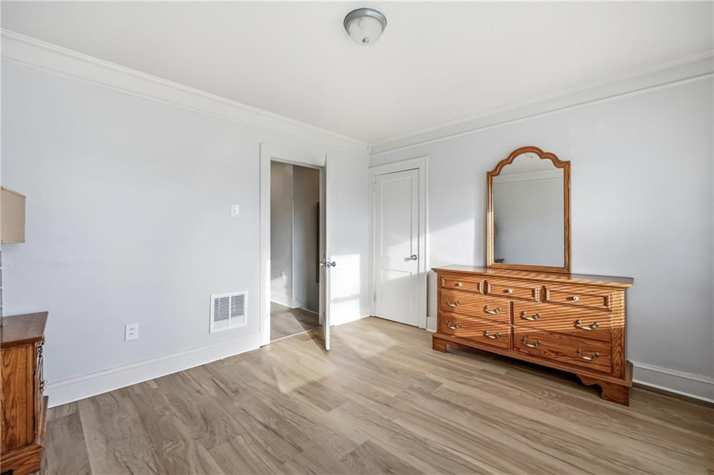 368 Stambaugh Avenue Sharon, PA 16146 - Photo 20 of 43 a room with a bed and a dresser