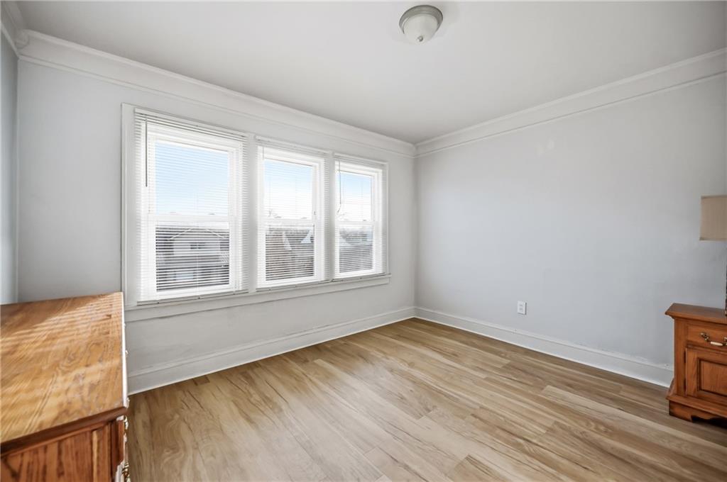 368 Stambaugh Avenue Sharon, PA 16146 - Photo 21 of 43 an empty room with wooden floor and windows