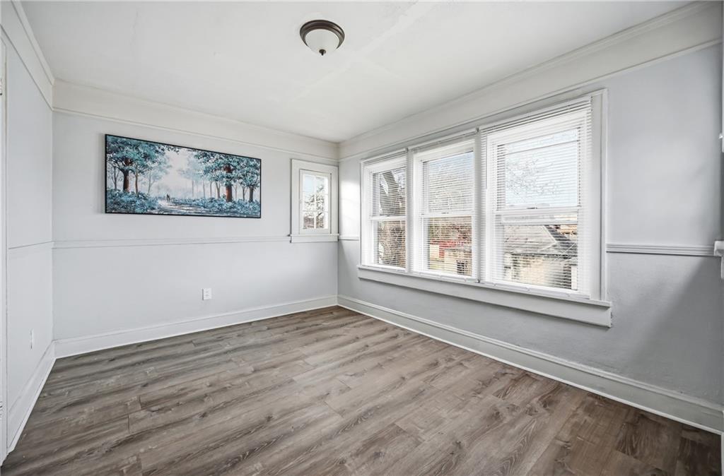 368 Stambaugh Avenue Sharon, PA 16146 - Photo 29 of 43 a view of an empty room with a window and wooden floor
