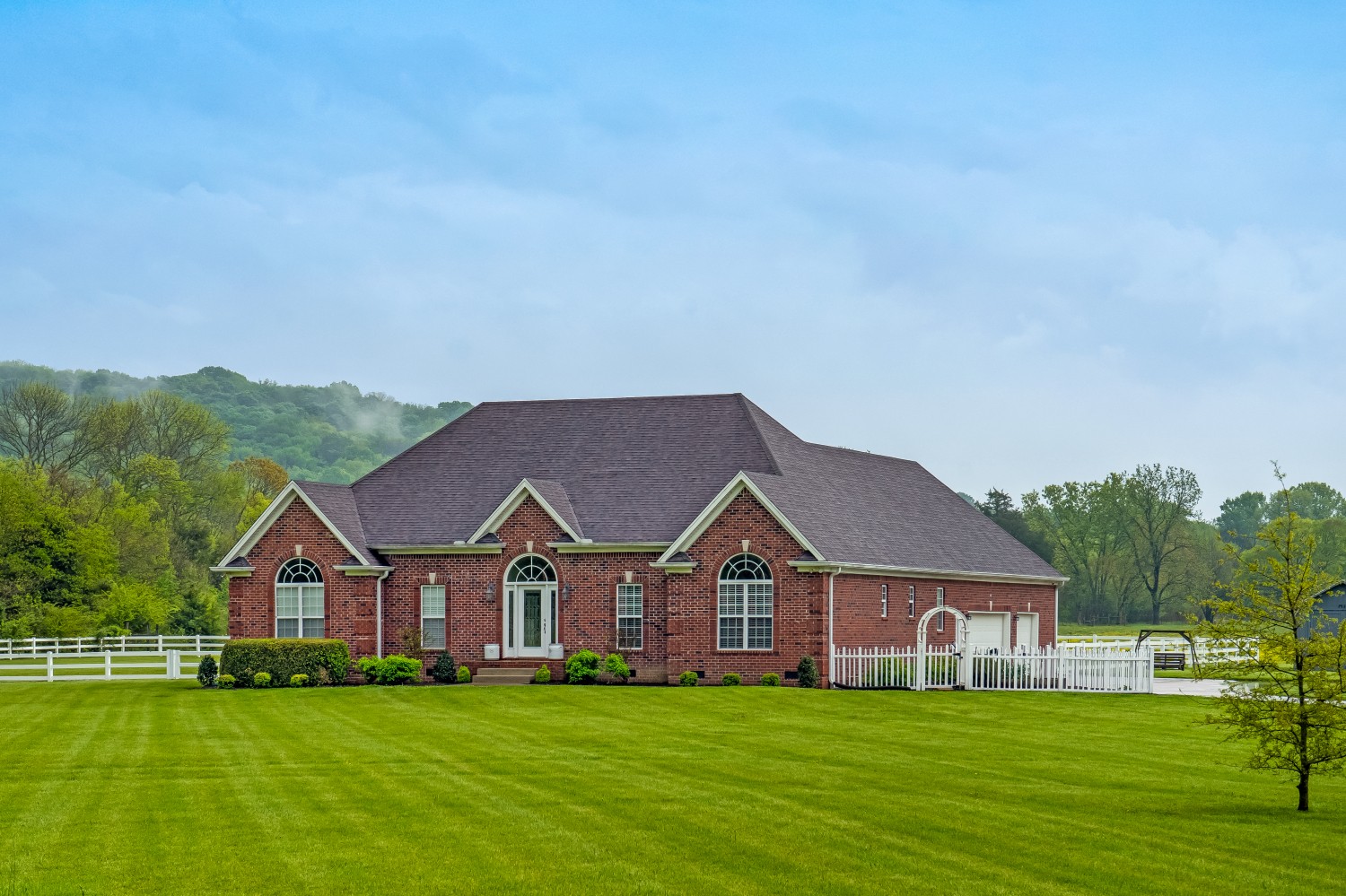 194 Greenvale Road Milton, TN 37118 - Photo 2 of 36 a view of a house with a big yard and large trees