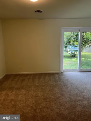 a view of a room with a window