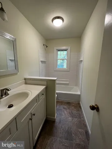 a bathroom with a sink and a bathtub
