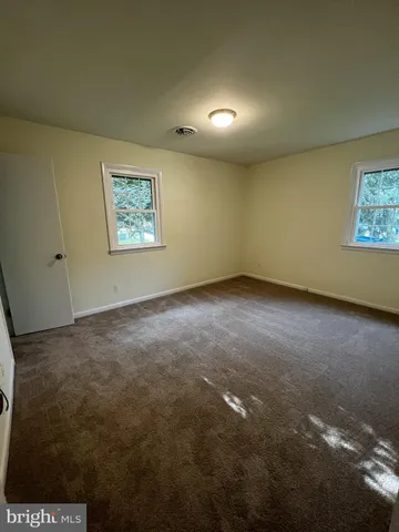 an empty room with a bench